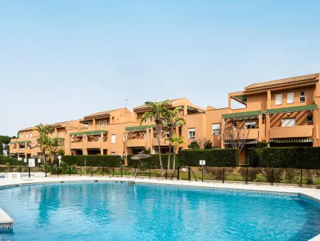 Location appartement à Chiclana de la Frontera, Confort et intimité à Chiclana : 2 chambres, jardin privé, animaux admis