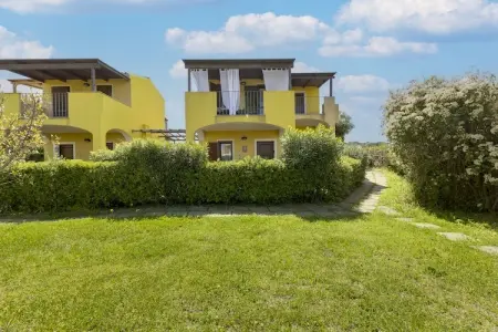 Location appartement à Viddalba, Maison de vacances avec climatisation et piscine partagée