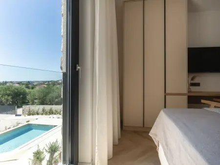 Villa Orkula à Rab : piscine chauffée et vue mer : photo 15