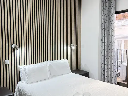 Studio 23 m² Gran Vía, balcon et climatisation