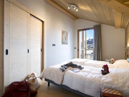 Appartement 4 chambres dernier étage, balcon 27m² - Huez : photo 9