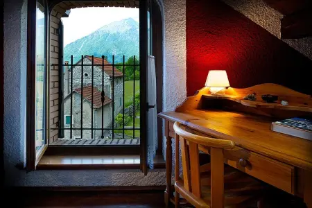 Casa delle Alpi, Chalet en Italie avec cheminée alpine - Photo 12