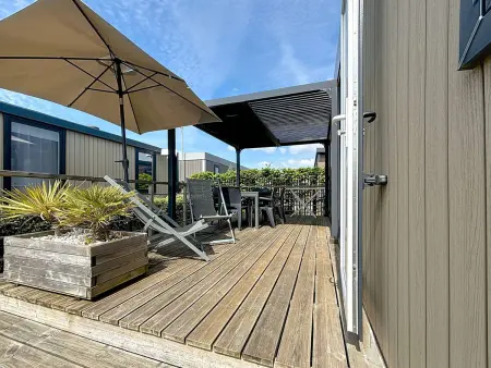 Location mobil home à Jullouville, Mobil-home Grand Confort 4 pers, 2 chambres, 1 sdb, clim, terrasse & parking, à 200m de la plage