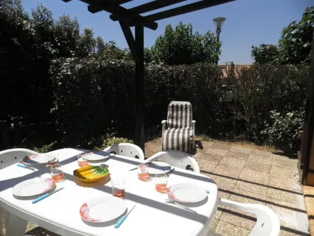 Location maison à Gruissan, Maison 2 pièces/mezzanine, 6 couchages, terrasse spacieuse, piscine et parking privé à Gruissan