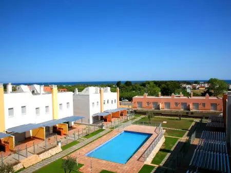 Location appartement à Creixell, Maison jumelée avec piscine et climatisation près de la plage