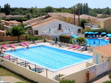 Location appartement à Cap d'Agde naturisme, Appartement climatisé pour 2 avec piscine et parking sécurisé