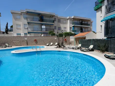 Location appartement à Torredembarra, AT052 Fibula: Planta baja con piscina a 600m de la Cala Canyadell